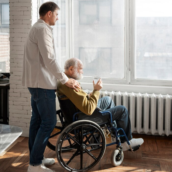 NDIS support worker helping participant with daily household activities at home in Melbourne