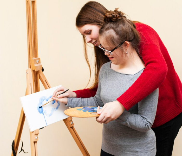 NDIS participant learning daily living and independent life skills with support worker in Melbourne